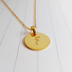 All of our products are handmade.A beautiful handmade 0.75" inch gold monogram necklace, you can choose any 1-3 initials.Necklace is Engraved - Not Stamped.The custom name disc necklace is made out of 925 sterling silver,it measures about 0.75",1.2mm thickness.The length of sterling silver chain can be selected in 14",16",18",20" or 22".You can have it done in sterling silver,18k gold plated,white gold plated.Please leave the text you would like to be engraved in the -notes to seller- section.In Gold Name Necklace With Round Pendant, Gold Charm Necklace With Round Pendant For Gift, Minimalist Gold Jewelry For Personal Use, Gold Initial Necklace With Round Pendant For Everyday, Gold Charm Necklace With Round Pendant For Personalized Gift, Customizable Gold Round Disc Charm Necklaces, Customizable Gold Round Disc Charm Necklace, Gold Initial Pendant Necklace For Personalized Gift, Nickel-free Gold Initial Pendant Necklace