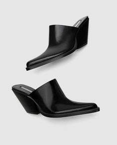 black clog-style shoes. High cut vamp. Smoke and pet free. Thanks for looking:) Formal Slip-on Clogs With Reinforced Heel, Modern Slip-on Heels With Wooden Heel, Casual Closed Toe Mules With Sculpted Heel, Modern Black Mules With Padded Heel, Slip-on Block Heel Mules With Padded Heel, Trendy Slip-on Heels With Reinforced Heel, Platform Heels Slip-on Medium Width, Formal Closed Toe Clogs With Padded Heel, Formal Clogs With Padded Heel