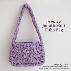 a crocheted purse hanging on a wall with the words, diy package jemlii mini hobo bag