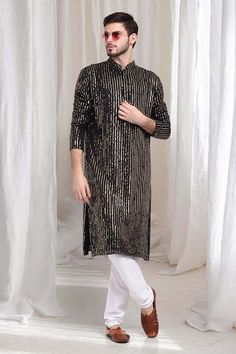 Black kurta with striped sequin work embroidery. Paired with solid churidaar. - Aza Fashions Navratri Straight Kurta With Sequins, Navratri Sequined Straight Kurta, Bollywood Style Sequined Straight Kurta, Bollywood Style Sequined Kurta With Traditional Drape, Designer Sequined Straight Kurta, Festive Straight Kurta With Sequins, Designer Sequined Kurta With Traditional Drape, Festive Sequins Straight Kurta, Festive Sequined Straight Kurta