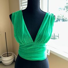 This Item Is The Privy Deep V-Neck Halter, And Comes With Thick Tie That You Can Style To Your Taste! The Size Is Medium. This Top Is Perfect For A Summer Outing With Friends! -Approximate Measurements- Bust- 20 Inches Waist-15 Inches Strings-30 Inches View Pics For Details Smoke Free/Pet Free Environment Feel Free To Make Me An Offer!! I Love Bundles!! Thanks For Stopping By My Closet!! Fitted V-neck Top For Summer Party, Green V-neck Top For Night Out, Fitted V-neck Top For Spring Party, Trendy V-neck Party Tops, Green V-neck Party Top, Trendy V-neck Tops For Party, Fitted V-neck Long Sleeve Top For Party, Chic Evening Crop Top With V-neck, Chic Evening V-neck Crop Top