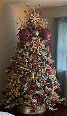 a christmas tree decorated with footballs and ornaments