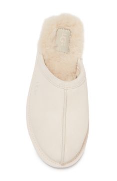 Slide into comfort with a faux fur lined slipper with clasic Ugg style. Round toe Slip-on Faux fur lining Leather upper, faux fur (80% wool, 20% lyocell) lining, manmade sole Imported Classic Indoor Slippers, Classic Indoor Slippers With Cushioned Footbed, Soft Casual Sheepskin Slippers, Casual Sheepskin Indoor Slippers, Casual Indoor Sheepskin Slippers, Casual Sheepskin Slippers With Plush Lining, Ugg Style, Slide Slipper, Womens Slippers