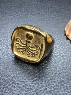 Chevalier Signet Ring for Him or Her handmade in Brass Goldplated 18K Made in any size you need, jewelry to be worn and enjoyed for a lifetime 22X23 mm Octopus was used in ancient coinage from Eretria to Syracuse Wax Carved Ring Silver Greek Signet, Greek Sun God, Octopus Ring, Greek Ring, Signet Rings, Greek Jewelry, Ancient Jewelry, Ancient Coins, Coin Jewelry