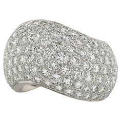 This Cartier wave ring features approximately 5.50 carats of round brilliant cut diamonds pave set in 18k white gold. Approximately 14mm wide Size 57 (8 US) 15.9 grams Numbered and signed Cartier Cartier Diamond, Wave Ring, Domed Ring, Cartier Ring, Round Brilliant Cut Diamond, Round Cut Diamond, Round Brilliant Cut, Brilliant Cut Diamond, Pave Diamonds