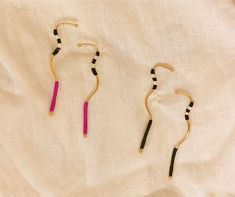 Material: 24k gold plated bronze with natural fiber threading from werregue palm. Length: 9.5cm Weight: 3g per earring Details: 100% Handmade in Colombia by the indigenous Woounan community. Threading, Natural Fibers, Gold Plate, Plating, Drop Earrings, Gold, Black