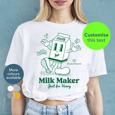 "Looking for a thoughtful gift for a mum or your best friend? Our personalised \"Milk Maker ...\" tee is perfect for baby showers, birthdays, or just because it's Tuesday. Grab your t-shirt today and let your unique mama style shine! PERSONALISATION Choose your text to sit beneath 'Milker Maker' e.g. Fresh from mama, For Emily, Since 2019 Alternatively you can leave this blank for just the 'Milk Maker' design. Please note, you will receive an email to check and complete the personalisation of your t-shirt yourself. What type of mama are you? HOW TO ORDER 1. Chose shirt colour Select from the drop down menu 2. Select shirt size See our size guide for details in the listings images 3. Add personalisation Simply add the text of your choice in the personalisation box and we'll do the rest 4. A Funny T-shirt With Name Print For Gift, Funny Customizable T-shirt For Gifts, Custom Print Green Tops For Gifts, Funny Green Tops As A Gift, Green Custom Print Top For Gift, Green Tops With Custom Print For Gift, Novelty Custom Print T-shirt For Gift, Personalized White T-shirt As Gift, White Novelty Tops As Gift