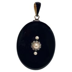 Georgian vintage 9k gold plated black emerald pearl  oval pendant for women Metal: yellow sterling silver Metal Purity: 925 Metal Wt: 10.900 Grams StoneType: natural pearl Stone Color: Green Emerald Cut: Excellent Emerald weight: 0.10 ctw Dimension:  Length: 1.5 Inches width:1.0 Product Color: Oxidized Black Rhodium on Diamond and Gold Rhodium on Sterling Silver Pearl Locket, Gold Locket, Pendant For Women, Diamonds And Gold, Black Rhodium, Oval Pendant, Natural Pearls, Rose Cut, Black Onyx