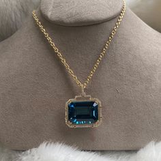 JP0059-LBT 'Gossip' London Blue Topaz Emerald Cut Pendant in 18K Yellow Gold with Diamonds 30'' Chain included. Stone Size: 24 x 18 mm Approx. gemstone Wt: 42.13 Carats (London Blue Topaz) Diamonds: G-H / VS, Approx Wt: 0.53 Cts Luxury Aquamarine Necklace For Formal Occasions, Luxury Aquamarine Pendant Necklace, Luxury Aquamarine Jewelry With Diamond Accents, Luxury Aquamarine Necklace For Anniversary, Formal Yellow Gold Aquamarine Necklace, Formal Aquamarine Gemstone Necklace, Luxury Large Stone Jewelry, Luxury Sapphire Necklace With Gemstone Accents, Luxury Diamond Necklace With Accent Stones