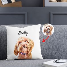 a pillow with a dog's face and name on it, next to a remote control