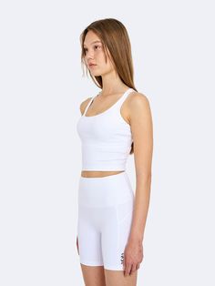 Editor's NotesThe Cross Comfort Tank Bra is a crop-length tank bra top made from light and elastic fabric that provides a comfortable fit with a cross-shaped shoulder strap on the back.- Logo print detail on the back- Cross-shaped shoulder strap on the back.- Neat slim fit- Simple design Measurements(in.)Size: Size (S/M/L)- Total Length: 12.2in. / 12.59in. / 12.99in.- Chest: 12.59in. / 13.38in. / 14.17in.- Hem: 11.02in. / 11.61in. / 12.2in. Composition & Care- Fabric: 80% Polyester Sleeveless High Stretch Crop Top With Built-in Bra, Sleeveless Gym Crop Top With Built-in Bra, Fitted Tank Top With Built-in Bra And Cross Back, Sporty Cami Crop Top With Built-in Bra, Versatile Activewear With Built-in Bra And Tank Straps, Functional Compressive Crop Top With Built-in Bra, Medium Support Cami Sports Bra With Built-in Bra, Fitted Crop Top With Built-in Bra For Gym, Versatile Compressive Crop Top With Built-in Bra