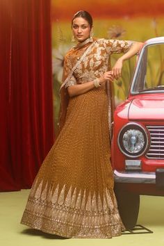 Caramel lehenga featuring zari, applique, sequin, cheed embellishment. Paired with a floral, leaf pattern embellished blouse and a dupatta. - Aza Fashions Festive Brown Pre-draped Saree For Wedding, Brown Anarkali Set With Dupatta For Festive Occasions, Festive Brown Anarkali Set With Dupatta, Brown Anarkali Set With Zari Work, Brown Bollywood Choli With Zari Work, Bollywood Style Brown Choli With Zari Work, Floor-length Pre-draped Saree For Reception With Dabka Work, Traditional Brown Sharara With Resham Embroidery, Festive Brown Lehenga With Dupatta