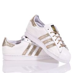 Adidas Superstar White Hive is the super glamorous custom women's sneaker. Entirely in white eco-leather with a geometric texture, featuring the iconic adidas stripes and a textured gold laminated back paired with round gold lurex laces. Adidas Superstar White Hive will also be provided with its original laces. Sporty Gold Sneakers With Perforations, Gold Low-top Sneakers With Perforations, White Leather Sneakers With Foil Embossed Logo, Geometric Texture, Zegna Shoes, Sneaker Wedge, Luxury Shop, Custom Shoes, Manolo Blahnik