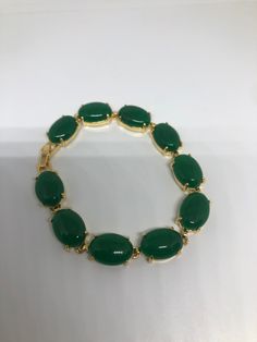 Vintage Green Jade Bracelet Golden white bronze vintage gold finished white bronze Does not tarnish Genuine green jade color enhanced 7.5 inches All jewelry is shipped free in the US in a nice gift box. Check out our over a THOUSAND great reviews Engraving is $4 per letter and is not always perfect depending on the piece. It can take a few days if the jeweler is busy. This is payable to Paypal Judithsltd@gmail.com Green Costume Jewelry Bracelets For Gifts, Classic Green Bracelets For Gifts, Green Jade Bracelets For Formal Occasions, Formal Gold Jade Bracelets, Formal Green Jade Bracelets, Adjustable Vintage Jade Bracelets, Luxury Vintage Jade Bracelets, Hand-strung Gold Jade Bracelets, Vintage Jade Bangle