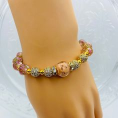 Elevate your style with these stunning bracelets for women, featuring luxurious 18k gold plated hematite beads paired with delicate pink lampwork glass beads and sparkling CZ inlaid spacer beads. The perfect gift for her, these bracelets combines elegance with a touch of glamour. Make a statement with these unique and eye-catching accessories that are sure to turn heads wherever you go. Handcrafted with care and attention to detail, they are sure to become a favorite accessory in any jewelry col Elegant Gemstone Beaded Bracelets, Adjustable Pink Gold Beaded Bracelets, Elegant Crystal Bracelet With 8mm Beads, Adjustable Pink Gold Beaded Bracelet, Spiritual Rose Gold Beaded Bracelets, Gold Bracelet With Faceted Beads, Elegant Rose Gold Jewelry With Gemstone Beads, Adjustable Pink Gold Bracelets With Round Beads, Adjustable Rose Gold Beaded Bracelets With 8mm Beads