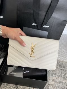 This Saint Laurent YSL Wallet on Chain Quilted Envelope Leather Cross Body Bag is a must-have for any fashion-forward woman. Crafted from high-quality leather, this medium-sized bag features a beautiful monogram pattern, quilted accents, and a sleek beige exterior color. The bag also comes with a chain strap for added convenience and versatility. The interior lining is made of soft leather and features a variety of compartments to keep your belongings organized. The bag is part of the Yves Saint Laurent Muse product line and is designed to showcase your sense of style. Whether you're running errands or heading out for a night on the town, this designer crossbody bag is the perfect accessory to complete your outfit. Some minor wear mark by the closure button Ysl Wallet On Chain Outfit, Wallet On Chain Outfit, Formal Clutch Purse, Ysl Wallet On Chain, Saint Laurent Purse, Ysl Wallet, Designer Crossbody Bag, Purse Essentials, Ysl Bags