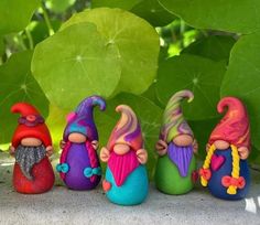 seven colorful gnomes are lined up in a row