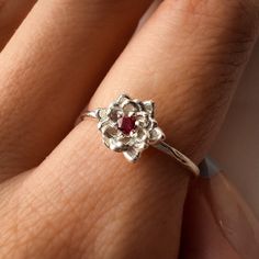 July Ruby Birth Flower Ring Material: Choose from Solid 14k Yellow Gold, 14k White Gold, 14k Rose Gold, or 925 Sterling Silver. Stone: 2 mm genuine AA grade brilliant cut Band: Solid 1.3 round band Water Lily Flower: Ruby Ring Water lily – Symbolize pleasure and peace Ruby Birthstone: The ruby has become a symbol of love and commitment. It was once thought to protect against misfortune and illness. ✿ This piece comes in a lovely Amelia Ray Jewelry gift box. My pieces are ideal gifts for birthday Water Lily Ring, July Birth Month, Ring With Ruby, Lily Ring, Ruby Birthstone, Birth Flower, Water Lily, Lily Flower, Ruby Ring