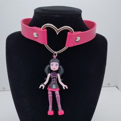 Handmade Ooak Draculaura Choker Necklace! Pink Vegan Leather Strap With Silver Heart Ring. Made With A Monster High Mega Bloks Draculaura Toy! 14" - 15.5" Adjustable Snap Closure. Cute And Weird (In The Best Possible Way)! Brand New, Never Worn. Keywords: Monster High Student Fairy Kei Fairycore Faecore Fairywave Cute Anime Original Weird Unique Funny Gift Kawaii Toy Harajuku Cartoon Pastelgoth Pastel Bubblegoth Bubble Upcycled Repurposed Recycled Rave Ravewear Decora Pink Black Vampire Dracula Handmade Pink Jewelry For Halloween, Pink Punk Choker As A Gift, Pink Punk Choker As Gift, Pink Punk Choker For Gift, Punk Style Pink Choker Gift, Pink Choker For Valentine's Day Gift, Handmade Punk Necklaces For Cosplay, Handmade Pink Harajuku Style Necklace, Handmade Adjustable Choker For Cosplay