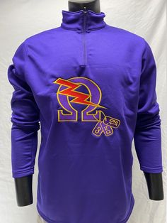 a mannequin wearing a purple shirt with an orange and yellow logo on it