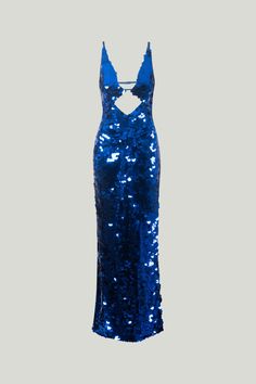 A dazzling blue sequin maxi dress. Featuring a deep back opening and a dramatic V-neckline. Inspired by a night of dancing, whether it's in the streets of Ibiza or the shores of Cartagena. Maxi Dress Deep V-Neck Open-Low Back Cutout at the Bodice Blue Floor-length Glamorous Sequin Dress, Glamorous Blue Sequin Maxi Dress, Glamorous Blue Evening Maxi Dress, Evening Backless Sequined Maxi Dress, Blue Floor-length Sequin Dress, Backless Sequin Maxi Dress For Gala, Backless Sequin Maxi Dress For Night Out, Blue Maxi Dress For Party Gala, Blue Maxi Dress For Gala Party