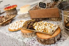 an assortment of desserts on display at a wedding reception