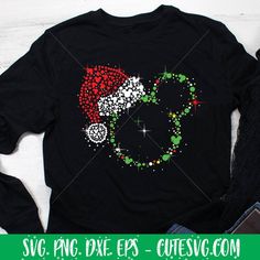 a black t - shirt with a santa hat on it's back and stars in the background