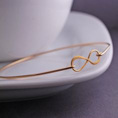 Gold Infinity Bracelet Infinity Symbol Jewelry by georgiedesigns, $38.00 Gold Infinity Bracelets For Mother's Day, Gold Infinity Bracelet For Mother's Day, Mother's Day Gold Infinity Bracelets, Minimalist Infinity Bracelets For Anniversary, Minimalist Infinity Bracelet For Anniversary, Elegant Gold Bracelets For Anniversary Gift, Infinity Symbol Jewelry, Gold Infinity Bracelet, Push Presents