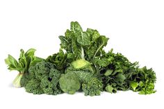 a pile of green vegetables on a white background