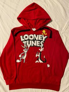 You are purchasing 1 Brand new with tags never worn officially licensed vintage retro LOONEY TUNES cartoon Women's JUNIORS girls Long Sleeve Pullover Hoodie Sweatshirt. Juniors is designed for young teen aged girls but can be worn by anyone that fits into the measurements that I have listed below. It is Red in color. It is made out a super soft to the touch 60% Cotton and 40% Polyester blend. Comes from a smoke and pet free home. I have many other Women's, Men’s and Boys LOONEY TUNES, MICKEY MOU Pop Culture Hoodie, Monkey Garage, Retro Fashion Outfits, Gas Monkey Garage, Looney Tunes Bugs Bunny, Child Star, Gas Monkey, Looney Tunes Cartoons, Grinch Christmas