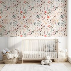 a baby's room with floral wallpaper and white crib in the foreground