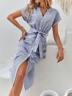 Elevate your style with our Chic and Playful dress! Featuring a flattering striped print, flowy batwing sleeves, and a belted waist for a perfect fit. Stay fashionable and comfortable with this versatile dress, perfect for any occasion. Expertly designed for a confident and stylish look. Color : Blue and White Style : Casual Pattern Type : Striped Sleeve Length : Short Sleeve Details : Belted Neckline : Notched Details : Button Front Type : Fitted Sleeve Type : Batwing Sleeve Waist Line : High Waist Hem Shaped : Straight Length : Long Fit Type : Regular Fit Fabric : Non-Stretch Material : Fabric Composition : 64% Polyester Composition : 36% Cotton Care Instructions : Machine wash or professional dry clean Belt : Yes Sheer : No Size US Belt Length Bust Cuff Hip Size Length Sleeve Length Wai Striped Belted Dress For Spring, Spring Striped Belted Dress, Chic Beach Belted Dress With Tie Waist, Chic Belted Dress With Tie Waist For The Beach, Chic Striped Belted Dress, Summer Casual V-neck Belted Dress, Casual V-neck Belted Dress For Summer, Casual V-neck Belted Summer Dress, Striped Tie Waist Dress For Day Out