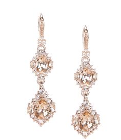 two pairs of earrings with pink stones and white diamonds on the bottom, set in 18k rose gold