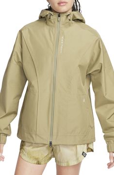 Power through wind and rain in this hooded running jacket in a lightweight, free-moving design bolstered with Gore-Tex weatherproofing. Conveniently placed storage lets you safely stash essentials, and the entire design packs into the pocket so you can gear up or down depending on the weather. Two-way front-zip closure Drawcord-toggle hood Adjustable hook-and-loop cuffs Front zip pockets; rear zip pocket Packs into pocket Back vent Gore-Tex Infinium insulation is windproof, water-resistant and b Gortex Jacket, Nike Web, Sports Wear Women, Packable Jacket, Women Sports, Outdoor Jacket, Sports Wear, Running Jacket, Wet Weather