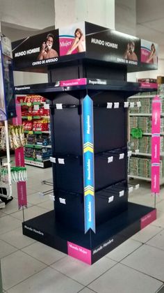 a display in the middle of a store with boxes stacked on it's sides