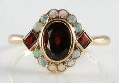 SHIVAY JEWELS 14k Rose Gold Plated  3.50Ct Oval Natural Red Garnet & Fire Opal Art Deco Ring We offer Customization If you want to add personal touch to this piece contact us and we will create one just for you. You can customize the following things given below : 1. Ring Resizing 2. Redesign 3. Metal Change ( 925 Sterling Silver / 10k Gold / 14k Gold / 18k Gold ) 4. Metal Color Change ( White / Rose / Yellow ) 5. Color Stones ( Red / Green / Yellow / Blue / Black ) 6. Engraving ( No. of characters will subject to size and space in the jewelry Payment  Policy 1. We accept payment via PayPal only. 2. You can also use a credit card for payment by using PayPal as a guest. 3. Payment is required within 3 days after buying. Shipping Policy 1. We ship worldwide. 2. Handling time is 5 business da Opal Art, Opal Ring Gold, Turkish Jewelry, Gold Art Deco, Garnet Jewelry, Deco Ring, Gold Art, Art Deco Ring, Opal Ring