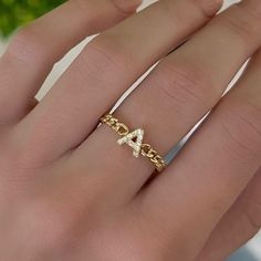 Show off your personality in style with our Chain Initial Stacking Ring! Wear your own initial or the initial of someone you love, you're sure to love stacking this ring. Metal: 14k White Gold / 14k Yellow Gold Round Brilliant Cut Natural Diamonds: Approx. 0.06-0.10 ctw depending on initial G/H Color and VS Clarity Diamonds Diamonds feature on top of the band Chain detailing featured halfway around the band 14k Gold Stackable Initial Open Ring, 14k Gold Stackable Initial Promise Ring, Fine Jewelry Stackable Initial Open Ring, Stackable 14k Gold Initial Promise Ring, Stackable Open Ring Initial In Fine Jewelry, Silver 14k Gold Stackable Initial Ring, Stackable Initial Ring In Yellow Gold And Sterling Silver, Stackable Sterling Silver Initial Ring In Yellow Gold, 14k Gold Monogram Rings