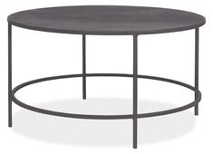 a round table with metal frame and grey top