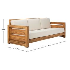 a wooden couch sitting on top of a white floor next to a ruler line with the measurements