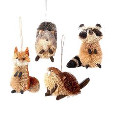 four stuffed animals hanging from strings in the shape of raccoon and hedgehogs