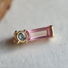 *You will receive a single tourmaline earring stud as you see from the picture. You can request to see your stones before/after placing the order. *See more earrings from this collection: https://www.etsy.com/shop/JadedDesignNYC?ref=seller-platform-mcnav§ion_id=49144957 **Ethically Sourced tourmaline, crafted with care and conscience for the conscious wearer. Each piece is handcrafted with Solid gold or silver in your choice. *Earring Size: Approximately 7mm*12mm  *Gem: Pink and blue tourmaline Multiple Rings, Gemstone Earrings Gold, Tourmaline Earrings, Bar Studs, Earring Stud, Blue Tourmaline, Earrings Studs, Wedding Jewelry Earrings, Unique Gemstones