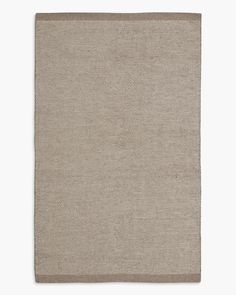 a beige rug on a white background with no one in it or someone out there