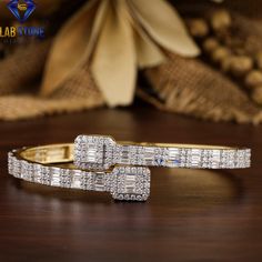 Welcome to our listing for a stunning Diamond Bracelet that will leave you truly mesmerized! We are blessed with 5000+ satisfied customer with great response. Bracelet-63 ✥ 𝐌𝐚𝐢𝐧 𝐒𝐭𝐨𝐧𝐞 𝐃𝐞𝐭𝐚𝐢𝐥𝐬 ↣ Shape : Baguette & Round Cut ↣ Type: CVD/HPHT ↣ Weight- 4.75 TDW- 234 Diamond  (0.04ct Baguette EF VS - 66 Diamond)  (0.01ct Round EF VS - 132 Diamond)  (0.01ct Round EF VS - 36 Diamond) ↣ Gold Weight ( Yellow Gold) : 10 K - 16.50 gm 14 K - 21.50 gm 18 K - 26.50 gm Comes in jewelry box  Ce Wedding Diamond Baguette Cut Bangle, Wedding Diamond Bangle With Baguette Cut, Wedding Baguette Diamond Tennis Bangle Bracelet, White Wedding Diamond Bracelet With Baguette Diamonds, Wedding Baguette Diamond Bangle, Wedding Bangle With Baguette Diamonds, White Baguette Diamond Tennis Bracelet For Wedding, Wedding Bangle Bracelet With Baguette Diamonds, Baguette Diamond Bangle Bracelet For Weddings