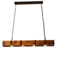 a wooden light fixture with three lights hanging from it's sides and chains on the bottom