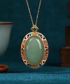 Elevate your style with our Women's Gold Copper Overgild Jade Enamel Pendant Necklace, adorned with auspicious clouds. This luxurious piece is crafted with intricate details, embodying elegance and exclusivity.Made of fine Copper Overgild Jade Enamel Auspicious Clouds.Length: 45cm/17.55". Matches easily with daily hairstyle, dresses & Shirts Traditional Jade Pendant Necklace, Traditional Engraved Jade Necklace, Oval Jade Necklaces For Wedding, Traditional Jade Medallion Jewelry, Traditional Jade Necklace With Round Pendant, Traditional Oval Ceremonial Necklaces, Traditional Oval Necklaces For Ceremonial Occasions, Engraved Jade Necklaces For Gifts, Engraved Jade Necklace Gift