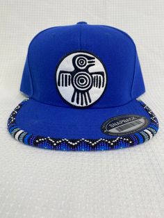 You are viewing a hand-beaded baseball hat with thunderbird patch. The hat is ADULT size. All beads are sewn by hand.  All patches are applied by hand. No two hats are exactly alike and will never be replicated exactly. Made by an indigenous artist, I am an enrolled member of the Jumano Nation of West Texas. Free shipping to US locations only Adjustable Flat Bill Snapback Hat For Festival, Festival Snapback Hat With Flat Bill, Traditional Adjustable Snapback Baseball Cap, Traditional Adjustable Snapback Hat, Metis Beadwork Patterns, Metis Beadwork, Bead Hat, Beaded Hats, Hat Burning