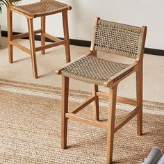 two wooden stools sitting next to each other on top of a carpeted floor