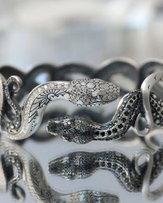 Luxury Snake-shaped Formal Bracelets, Luxury Formal Snake Bracelet, Luxury Silver Jewelry With Artistic Design, Luxury Hand Forged Jewelry For Anniversary, Luxury Hand Forged Ceremonial Jewelry, Luxury Hand Forged Fine Jewelry, Luxury Adjustable Ornate Jewelry, Luxury Adjustable Intricate Design Jewelry, Serpent Jewelry Men