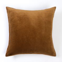 a brown pillow on a white background