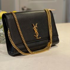 Used It For About One Year And Then Stored Away. In Very Good Condition And Edges Of The Bag Look Brand New. Classic Saint Laurent Monogram Shoulder Bag Made With Metal-Free Tanned Leather And Organic Cotton Lining, Decorated With Metal Ysl Initials And Chain Tassel, Featuring A Chain Shoulder Strap. Measurements: 11 1/4 L 7 3/8 W 2 1/8 D 17 Inches Chain Drop Classic Gold Wallet On Chain, Timeless Gold Bags With Gold-tone Logo Plaque, Luxury Formal Bags With Gold Chain, Classic Gold Wallet On Chain For Formal Events, Classic Gold Wallet On Chain For Formal Occasion, Elegant Gold Wallet On Chain, Elegant Gold Wallet On Chain With Chain Detail, Classic Evening Bags With Gold-tone Logo Plaque, Classic Leather Wallet On Chain For Party